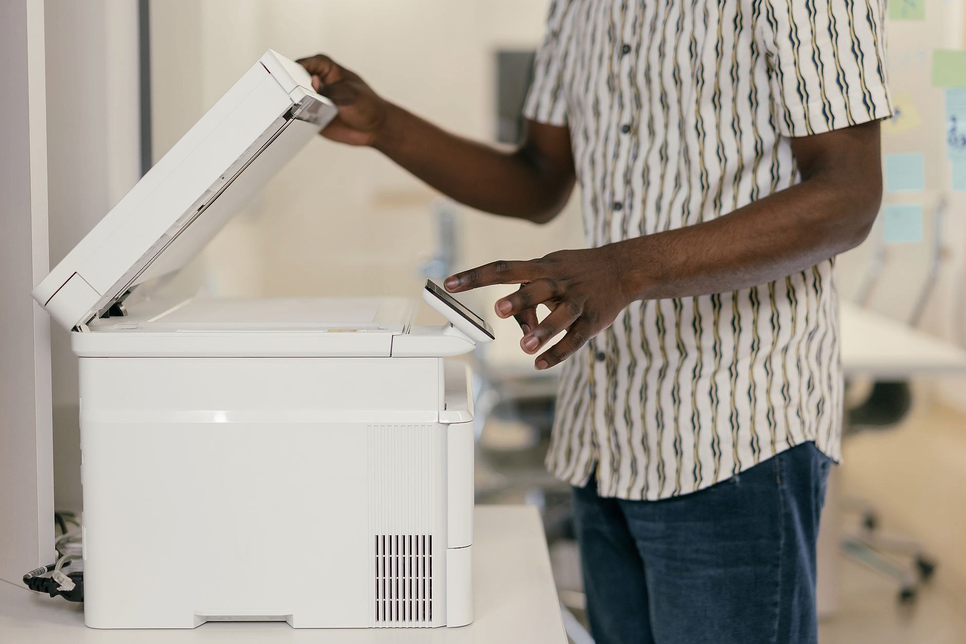 Office worker scanning documents into digital system
